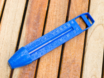 Swimming pool thermometer on deck